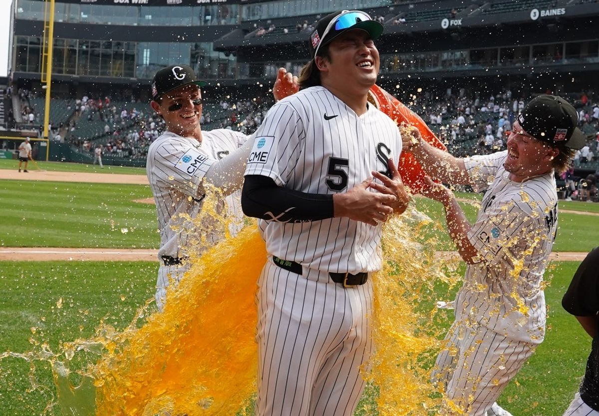 Jul 26, 2026; Chicago, Illinois, USA; Chicago White Sox first baseman Munetaka Murakami (5) is douse with gatorade by catcher Drew Romo (L) and second baseman Chase Meidroth (R) after the Sox defeated the Houston Astros at Rate Field. Mandatory Credit: David Banks-Imagn Images
