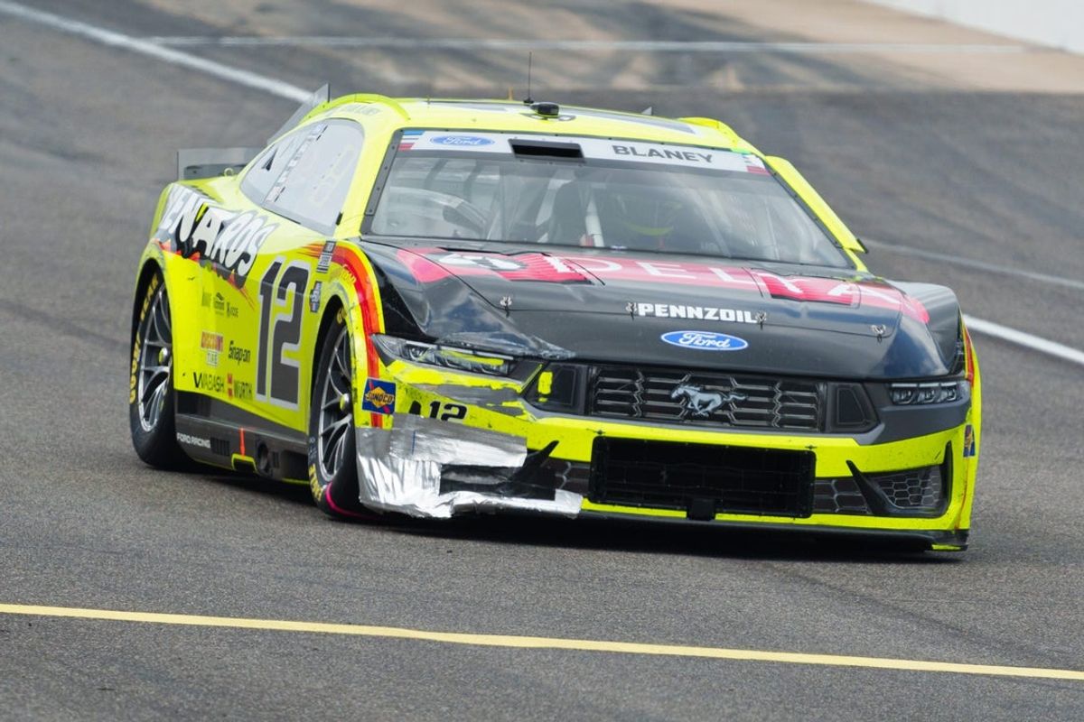 NASCAR Cup Series driver Ryan Blaney (12) leaves pit lane after stopping for repairs Sunday, July 26, 2026, during the Brickyard 400 at Indianapolis Motor Speedway.