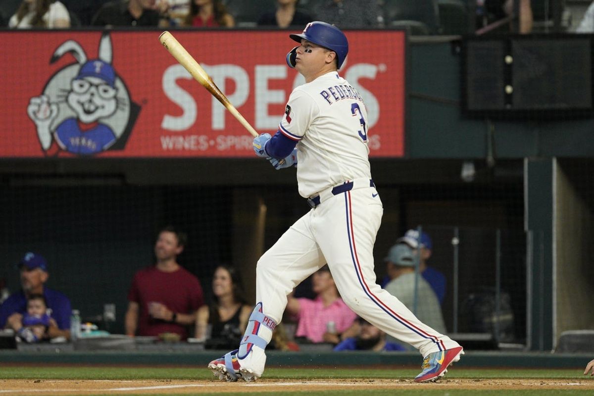 Jul 27, 2026; Arlington, Texas, USA;  Texas Rangers designated hitter Joc Pederson (3) hits a solo home run against the Seattle Mariners during the first inning at Globe Life Field. Mandatory Credit: Raymond Carlin III-Imagn Images