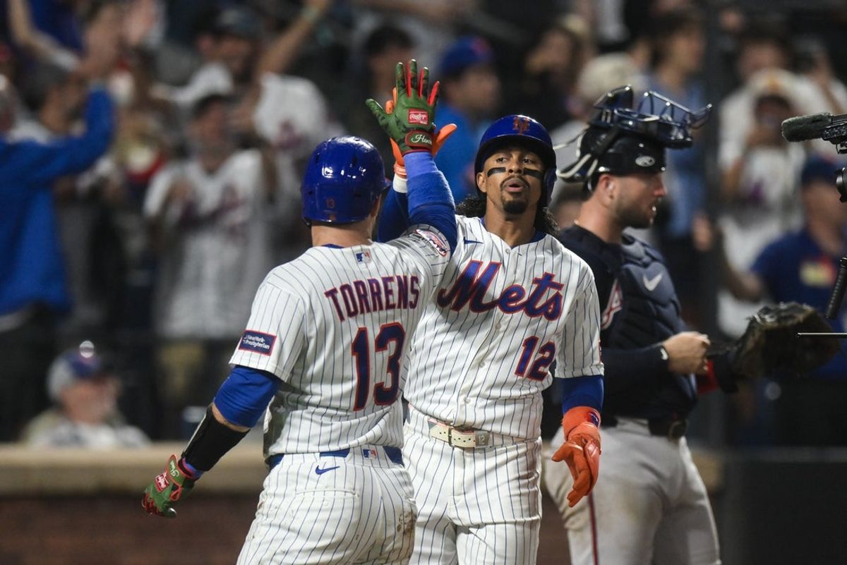 Jul 27, 2026; New York City, New York, USA; New York Mets shortstop Francisco Lindor (12) is greeted at home plate by catcher Luis Torrens (13) after hitting a three run home run against the Atlanta Braves during the eighth inning at Citi Field. Mandatory Credit: John Jones-Imagn Images
