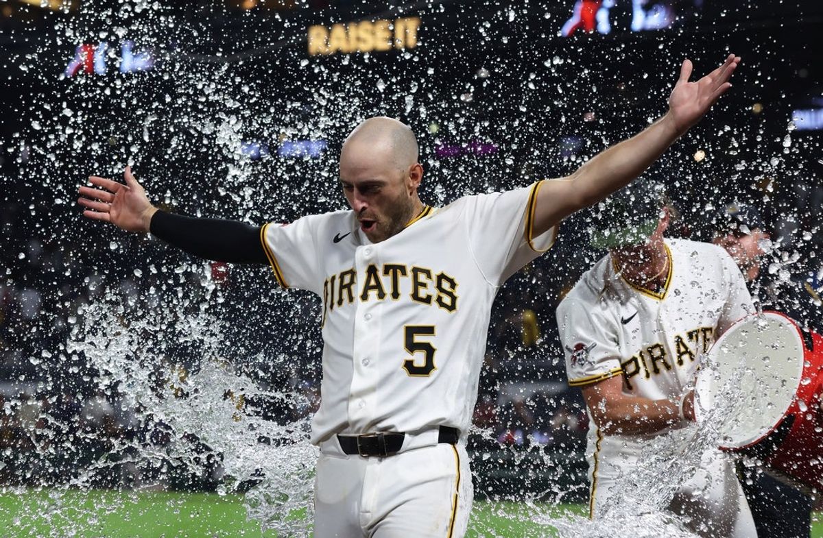 Jul 27, 2026; Pittsburgh, Pennsylvania, USA;  Pittsburgh Pirates second baseman Brandon Lowe (5) receives a water bath after hitting an RBI single to defeat the Arizona Diamondbacks in ten innings at PNC Park. Mandatory Credit: Charles LeClaire-Imagn Images