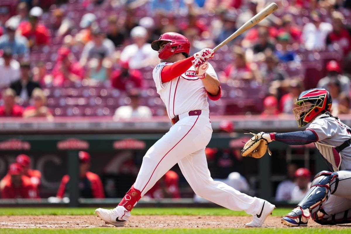 Jul 28, 2026; Cincinnati, Ohio, USA;  Cincinnati Reds first baseman Sal Stewart (27) hits a two-run single against the Cleveland Guardians in the fourth inning at Great American Ball Park. Mandatory Credit: Aaron Doster-Imagn Images