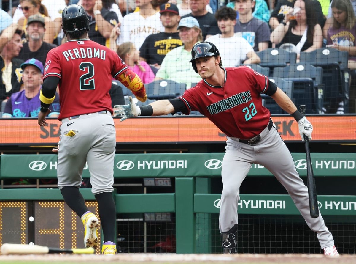 Jul 28, 2026; Pittsburgh, Pennsylvania, USA;  Arizona Diamondbacks left fielder Max Kepler (22) congratulates shortstop Geraldo Perdomo (2) after Perdomo scored a run against the Pittsburgh Pirates during the first inning at PNC Park. Mandatory Credit: Charles LeClaire-Imagn Images