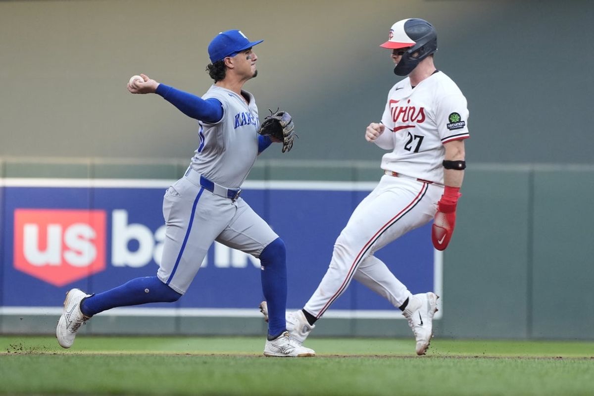 Jul 28, 2026; Minneapolis, Minnesota, USA; Kansas City Royals third baseman Josh Rojas (40) forces out Minnesota Twins catcher Ryan Jeffers (27) and turns a double play on a ball hit by second baseman Kody Clemens (not pictured) in the first inning at Target Field. Mandatory Credit: Bruce Kluckhohn-Imagn Images