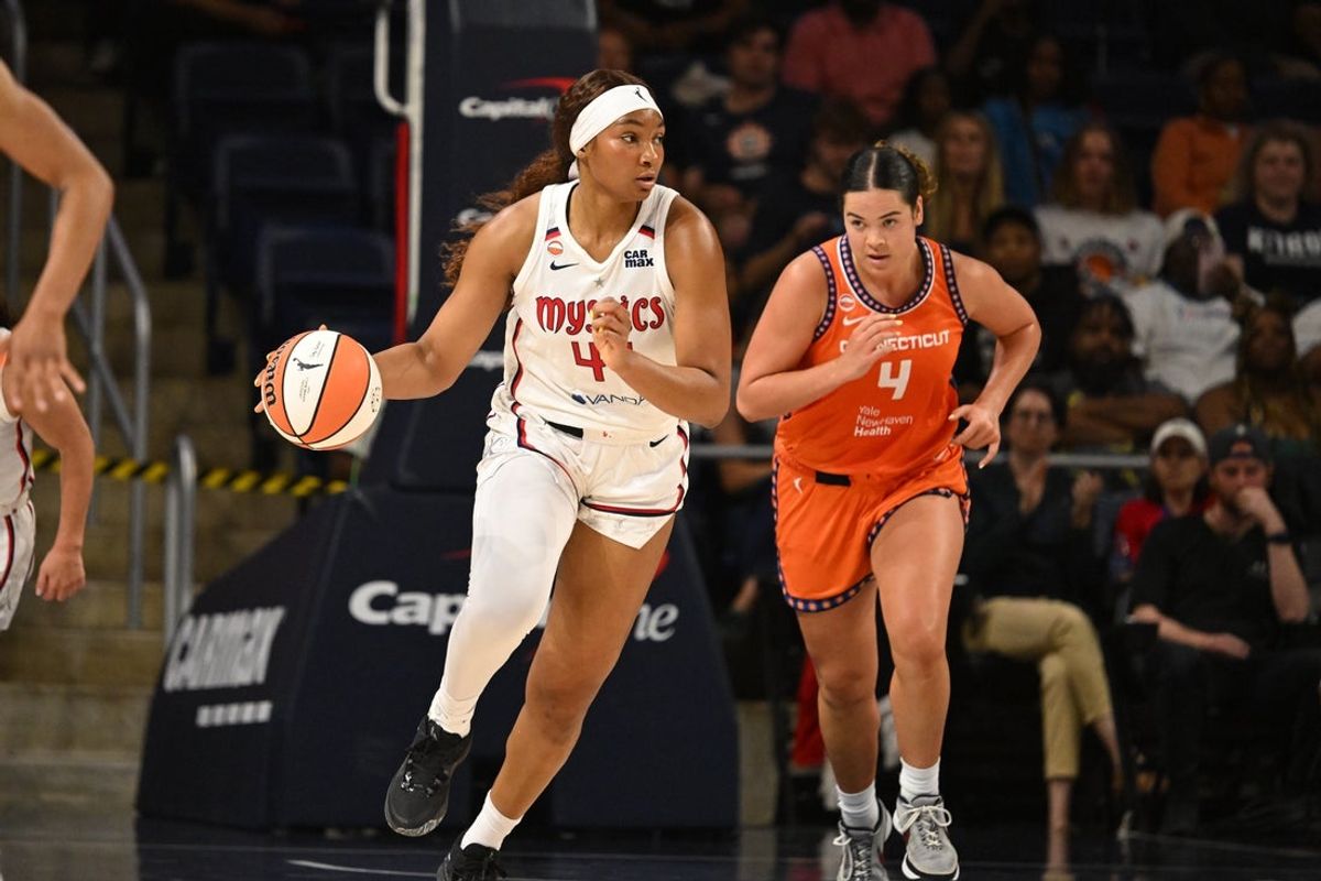 Jul 28, 2026; Washington, District of Columbia, USA;  Washington Mystics forward Kiki Iriafen (44) dribbles the ball in front of Connecticut Sun guard Charlisse Leger-Walker (4) during the second quarter at CareFirst Arena. Mandatory Credit: Rafael Suanes-Imagn Images