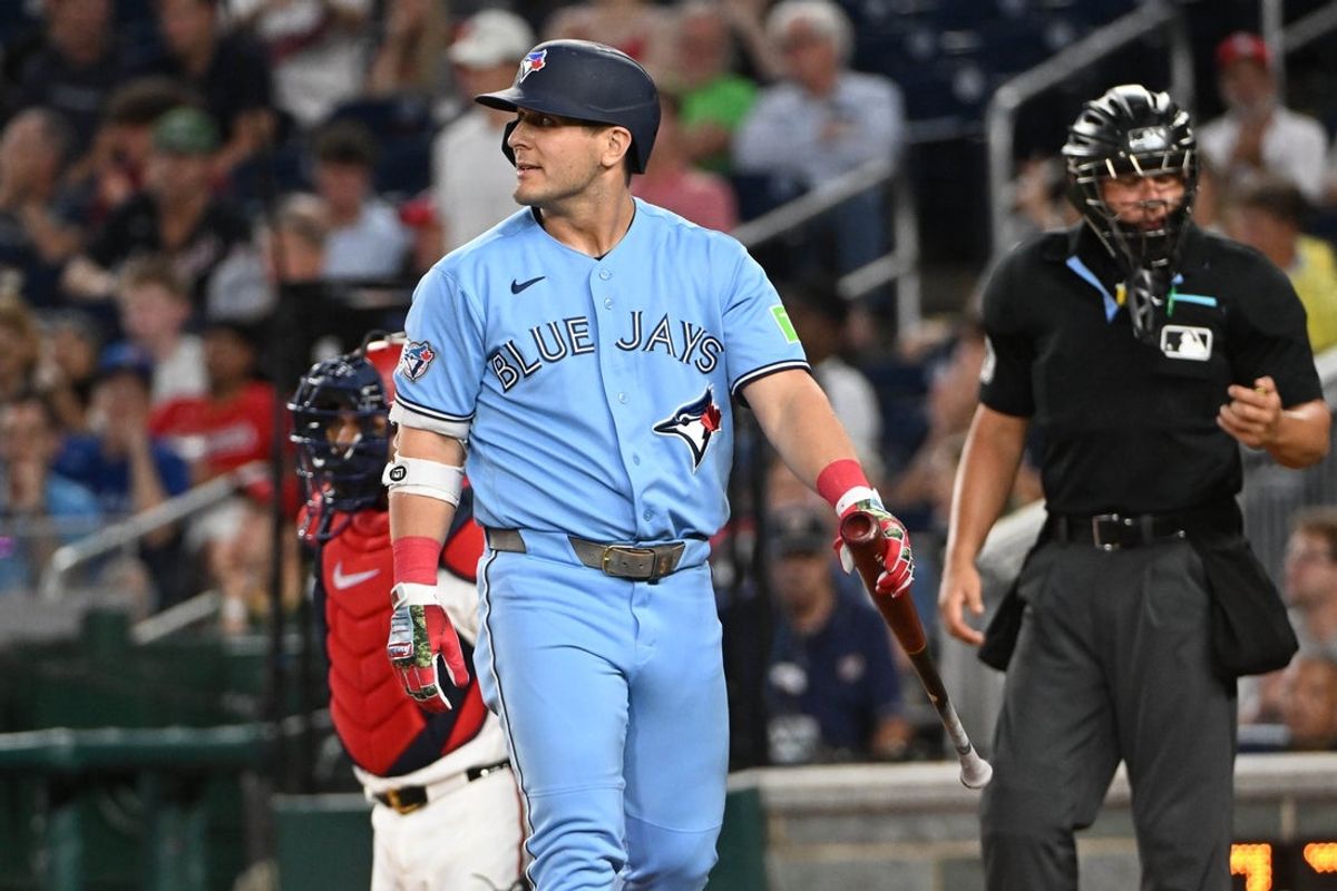 Jul 28, 2026; Washington, District of Columbia, USA; Toronto Blue Jays center fielder Daulton Varsho (5) reacts after striking out against the Washington Nationals during the second inning at Nationals Park. Mandatory Credit: Brad Mills-Imagn Images