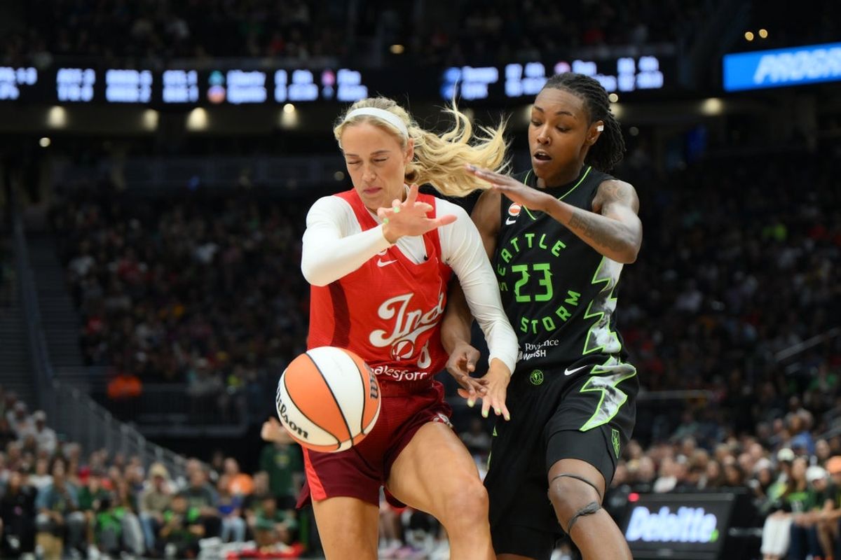 Jul 28, 2026; Seattle, Washington, USA; Indiana Fever guard Sophie Cunningham (8) and Seattle Storm forward Jordan Horston (23) fight for the losse ball during the first half at Climate Pledge Arena. Mandatory Credit: Steven Bisig-Imagn Images