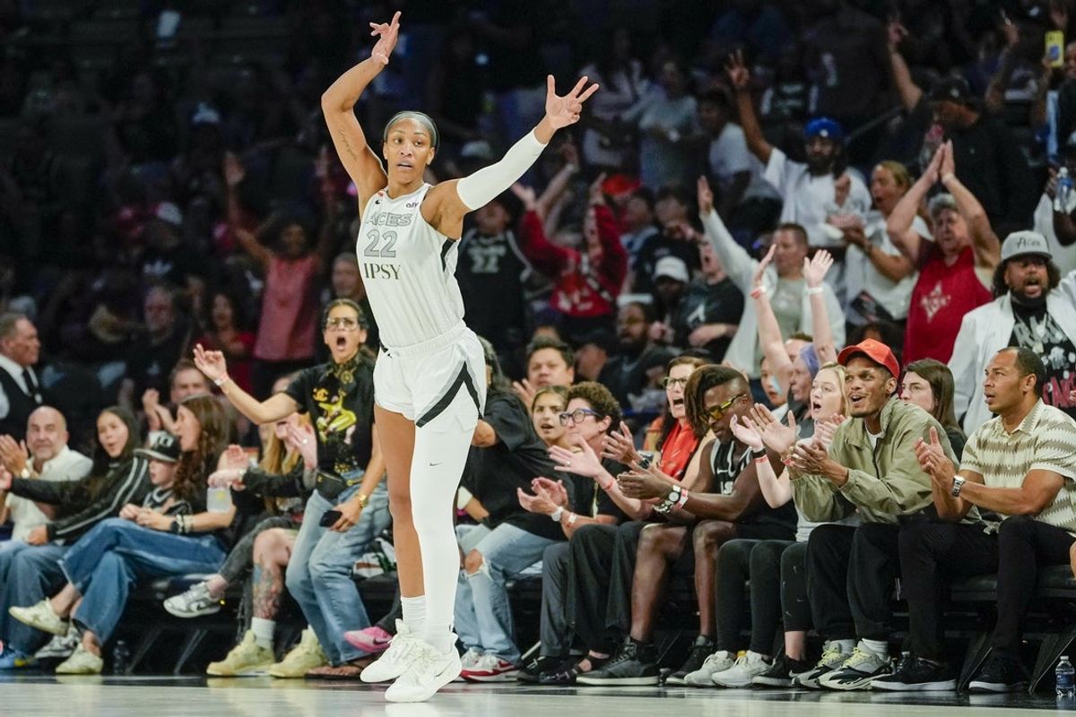 Jul 28, 2026; Las Vegas, Nevada, USA; Las Vegas Aces center A'ja Wilson (22) celebrates after scoring against the Portland Fire during the first quarter of a WNBA basketball game at Michelob Ultra Arena. Mandatory Credit: Lucas Peltier-Imagn Images