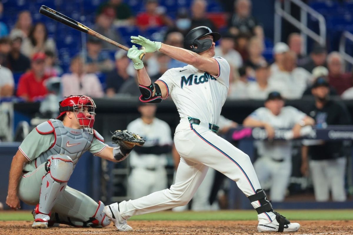 Jul 29, 2026; Miami, Florida, USA; Miami Marlins pinch hitter Griffin Conine (18) hits a two-run home run against the Philadelphia Phillies during the eighth inning at loanDepot Park. Mandatory Credit: Sam Navarro-Imagn Images