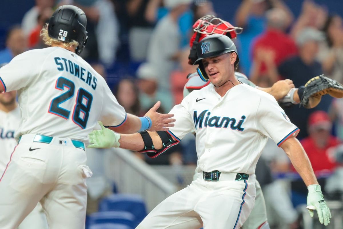 Jul 29, 2026; Miami, Florida, USA; Miami Marlins pinch hitter Griffin Conine (18) celebrates with left fielder Kyle Stowers (28) after hitting a two-run home run against the Philadelphia Phillies during the eighth inning at loanDepot Park. Mandatory Credit: Sam Navarro-Imagn Images