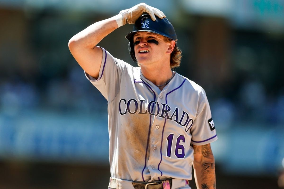 Jul 29, 2026; San Diego, California, USA; Colorado Rockies center fielder Cole Carrigg (16) reacts after being picked off of first base during the sixth inning by San Diego Padres relief pitcher Griffin Canning (17) at Petco Park. Mandatory Credit: David Frerker-Imagn Images