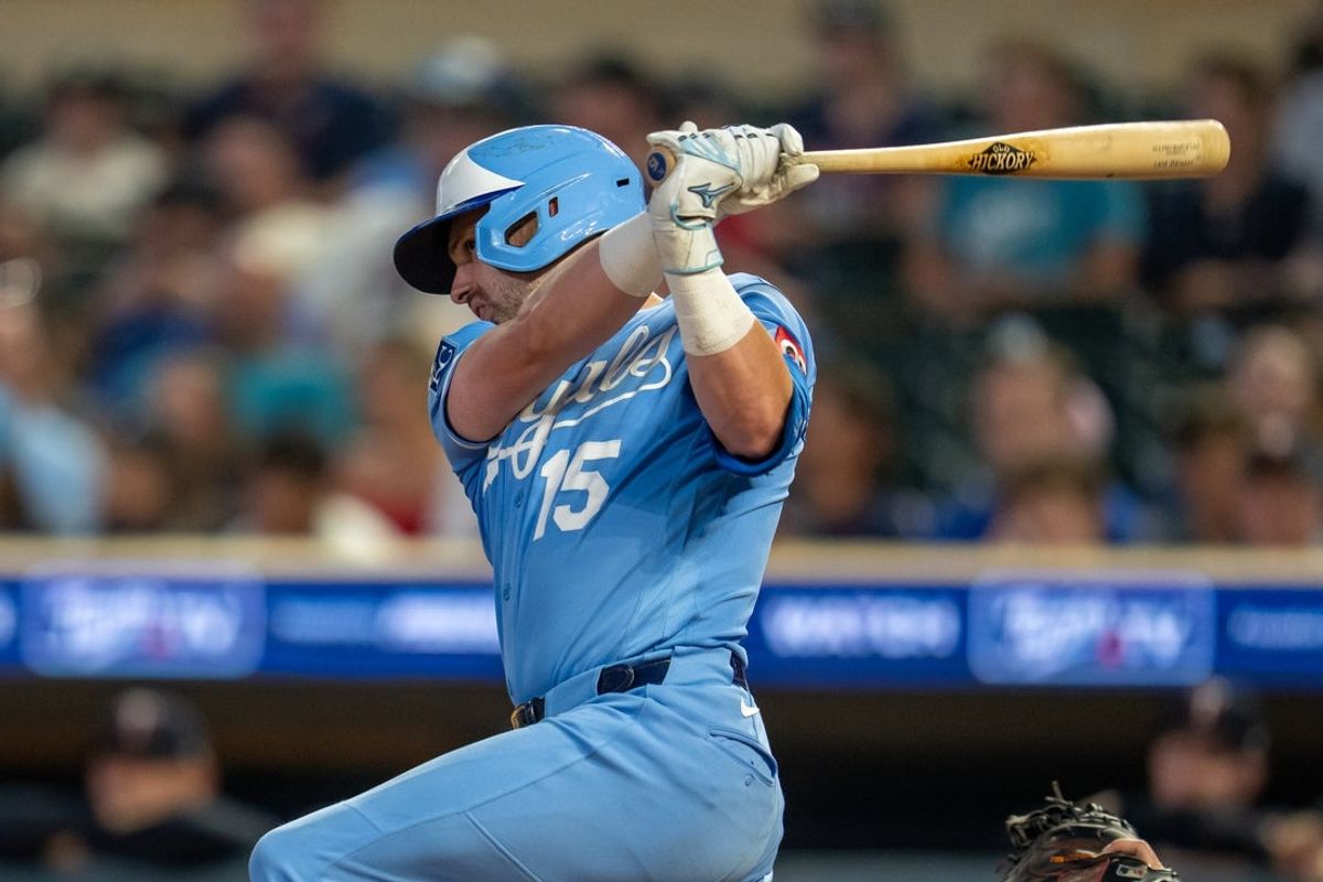 Jul 29, 2026; Minneapolis, Minnesota, USA; Kansas City Royals center fielder Lane Thomas (15) hits a single against the Minnesota Twins in the ninth inning against the Minnesota Twins at Target Field. Mandatory Credit: Jesse Johnson-Imagn Images