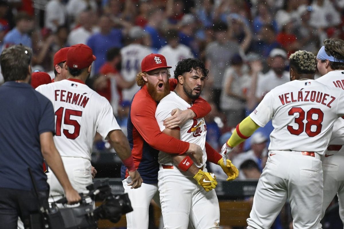Jul 29, 2026; St. Louis, Missouri, USA; St. Louis Cardinals designated hitter Ivan Herrera (48) is congratulated by St. Louis Cardinals pitcher Dustin May (3) after hitting a walk-off two-run home run against the Chicago Cubs in the tenth inning at Busch Stadium. Mandatory Credit: Joe Puetz-Imagn Images