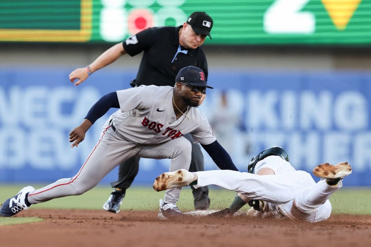 Jul 29, 2026; West Sacramento, California, USA; Athletics center fielder Henry Bolte (33) is tagged out on a steal attempt by Boston Red Sox shortstop Andruw Monasterio (32) during the third inning at Sutter Health Park. Mandatory Credit: Sergio Estrada-Imagn Images