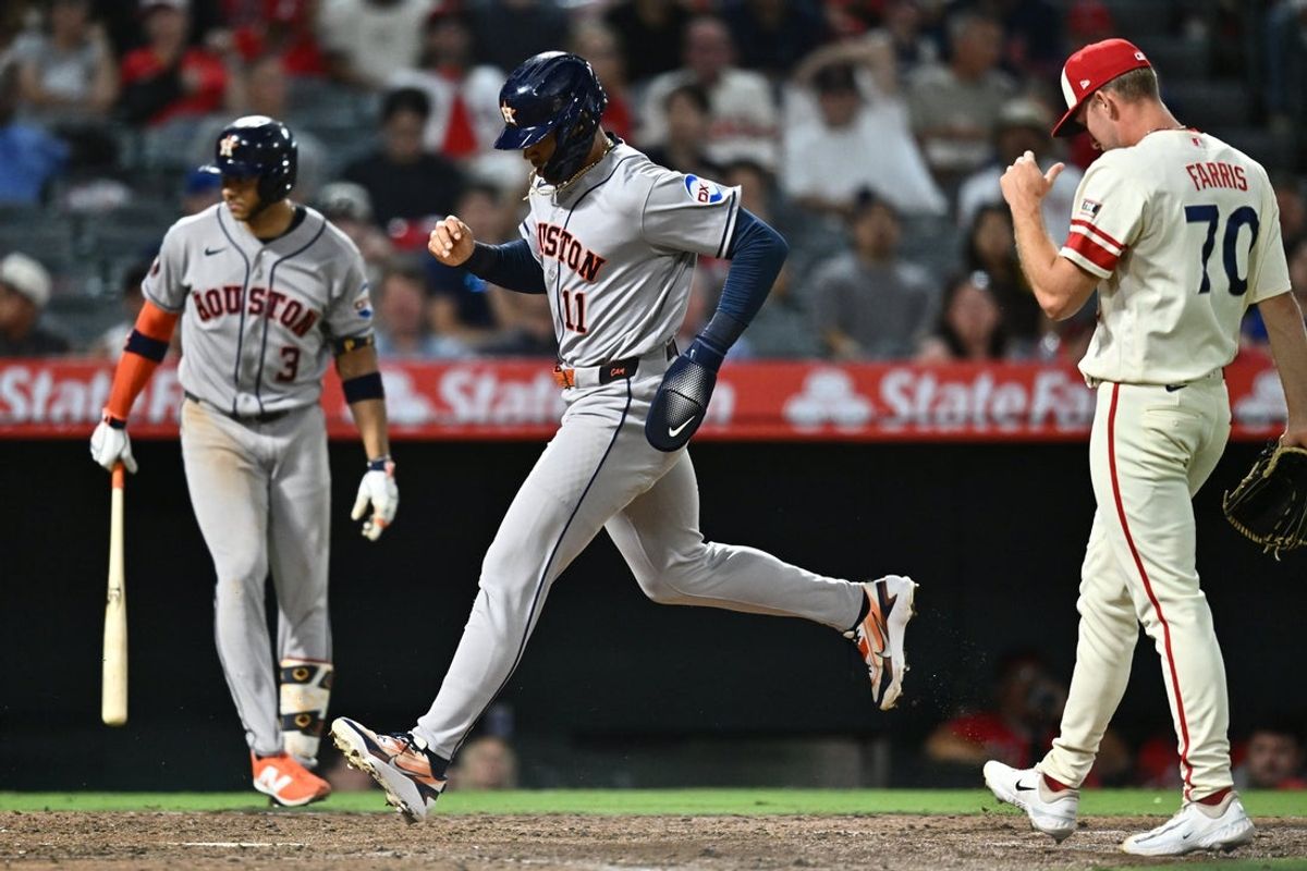 Jul 29, 2026; Anaheim, California, USA; Houston Astros right fielder Cam Smith (11) scores on a wild pitch by Los Angeles Angels pitcher Mitch Farris (70) during the sixth inning at Angel Stadium. Mandatory Credit: William Liang-Imagn Images