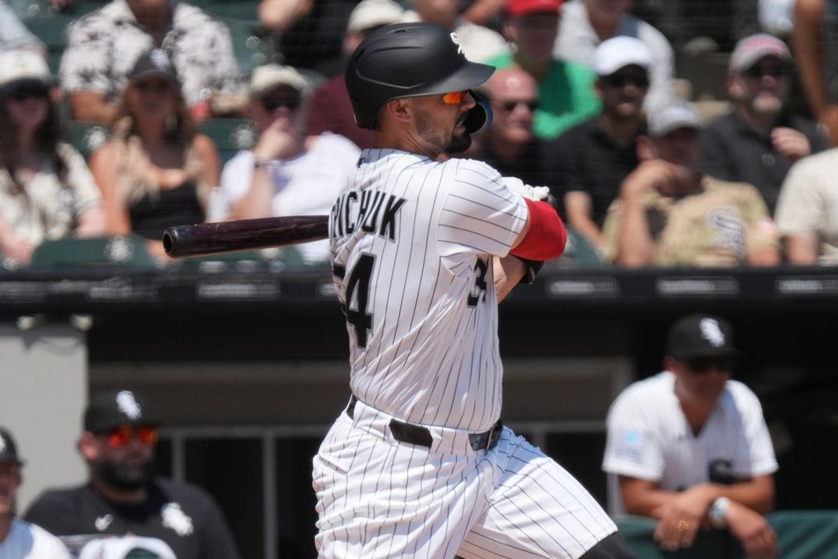 Jul 30, 2026; Chicago, Illinois, USA; Chicago White Sox designated hitter Randal Grichuk (34) hits a double against the New York Yankees during the first inning at Rate Field. Mandatory Credit: David Banks-Imagn Images