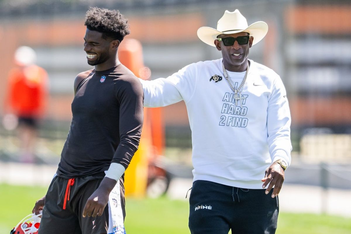 Jul 30, 2026; Berea, OH, USA; Cleveland Browns quarterback Shedeur Sanders (2) talks with his father Deion Sanders during training camp at CrossCountry Mortgage Campus. Mandatory Credit: Ken Blaze-Imagn Images