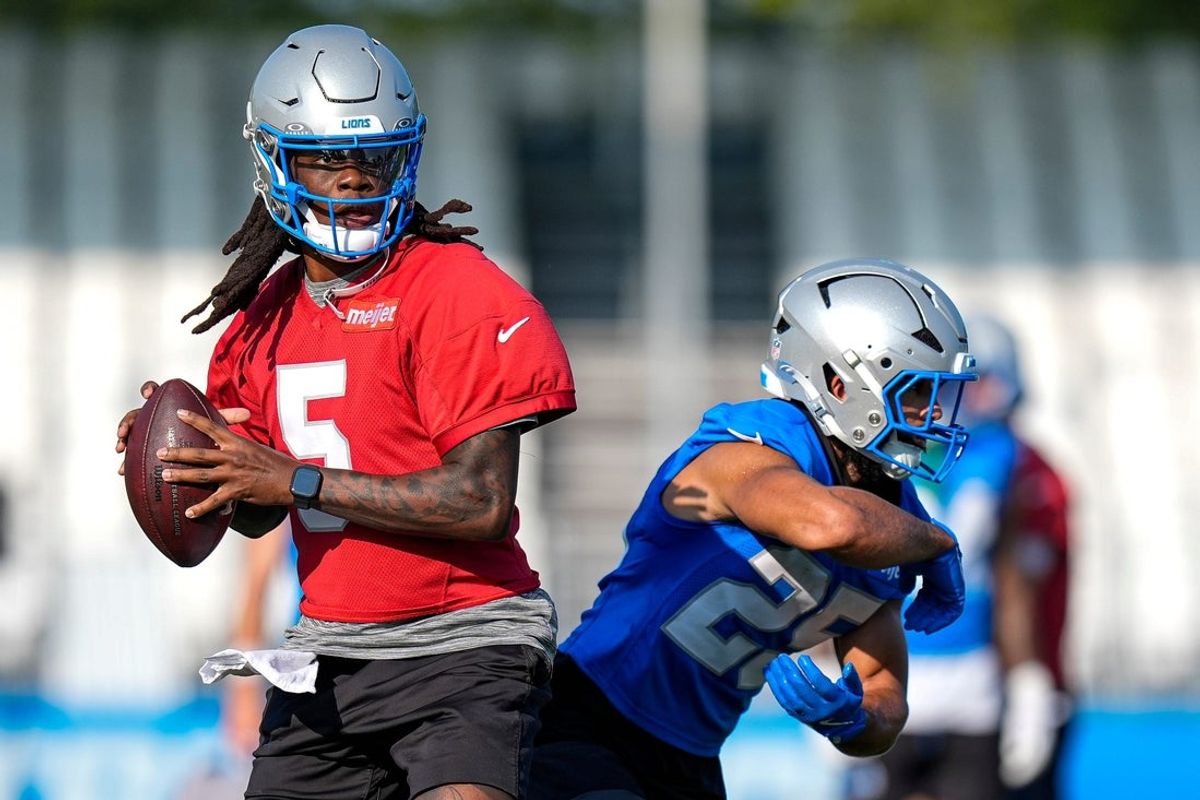 Detroit Lions quarterback Teddy Bridgewater (5) and running back Jacob Saylors (25) practice during training camp at Meijer Performance Center in Allen Park on Friday, July 31, 2026.