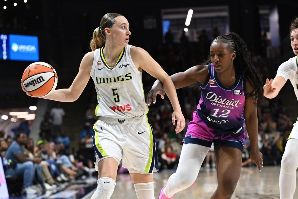 Jul 31, 2026; Washington, District of Columbia, USA; Dallas Wings guard Paige Bueckers (5) looks to pass as Washington Mystics forward Michaela Onyenwere (12) defends at CareFirst Arena. Mandatory Credit: Brad Mills-Imagn Images