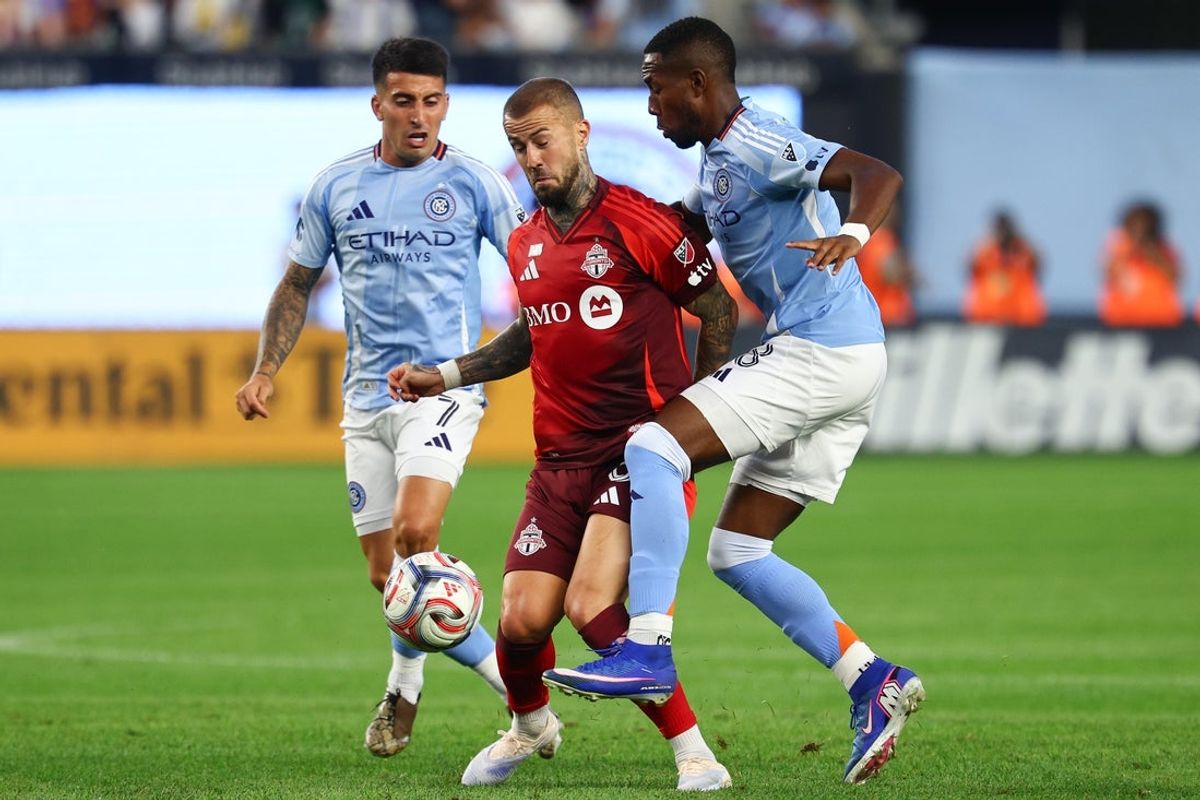 Jul 31, 2026; New York, New York, USA; Toronto FC midfield Niklas Dorsch (6) in action against New York City FC midfield Andres Perea (8) during the first half at Yankee Stadium. Mandatory Credit: Vincent Carchietta-Imagn Images