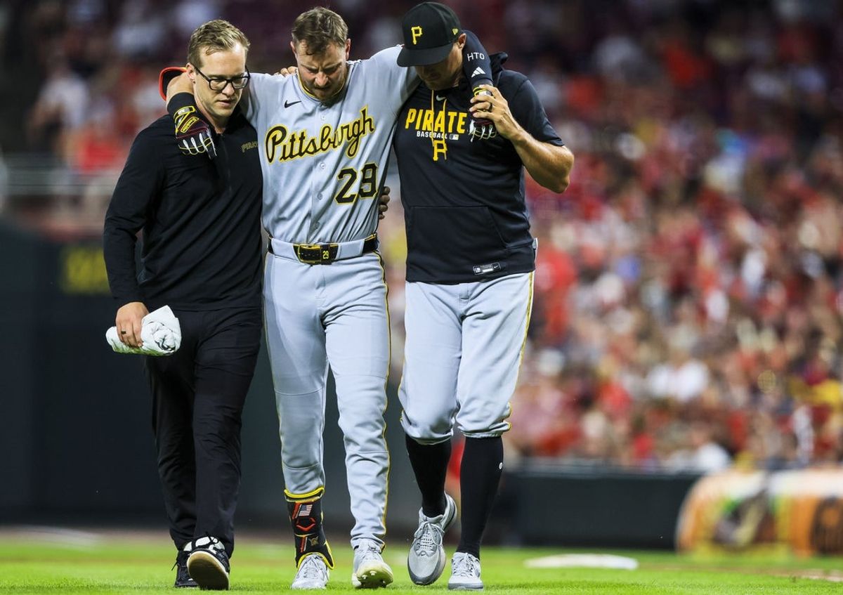 Jul 31, 2026; Cincinnati, Ohio, USA; Pittsburgh Pirates designated hitter Ryan O'Hearn (29) walks off the field with assistance in the ninth inning against the Cincinnati Reds at Great American Ball Park. Mandatory Credit: Katie Stratman-Imagn Images
