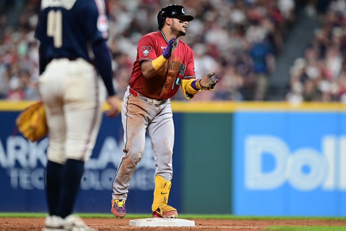 Jul 31, 2026; Cleveland, Ohio, USA; Arizona Diamondbacks catcher Gabriel Moreno (14) reacts at second base during the eighth inning against the Cleveland Guardians at Progressive Field. Mandatory Credit: David Dermer-Imagn Images