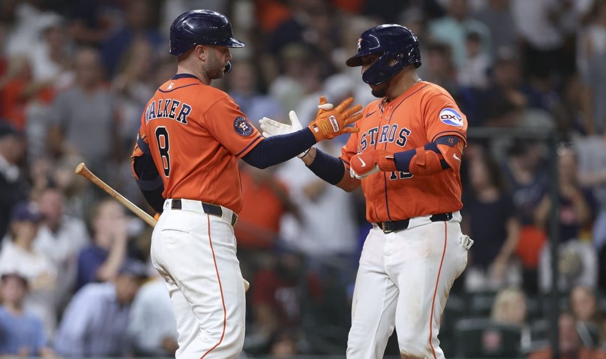 Jul 31, 2026; Houston, Texas, USA; Houston Astros third baseman Isaac Paredes (15) celebrates with first baseman Christian Walker (8) after. hitting a home run during the fifth inning against the Texas Rangers at Daikin Park. Mandatory Credit: Troy Taormina-Imagn Images