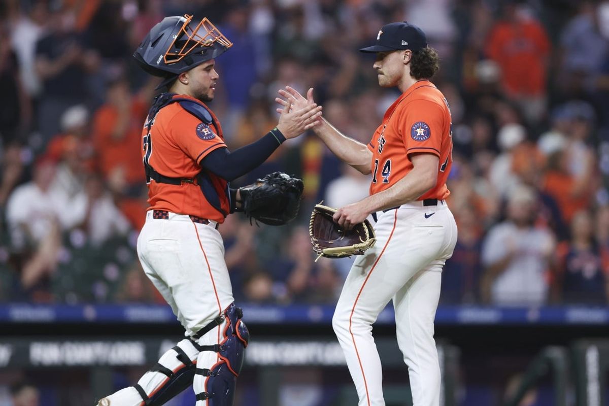 Jul 31, 2026; Houston, Texas, USA; Houston Astros pitcher Bryan King (74) celebrates with catcher Yainer Diaz (21) after the game against the Texas Rangers at Daikin Park. Mandatory Credit: Troy Taormina-Imagn Images