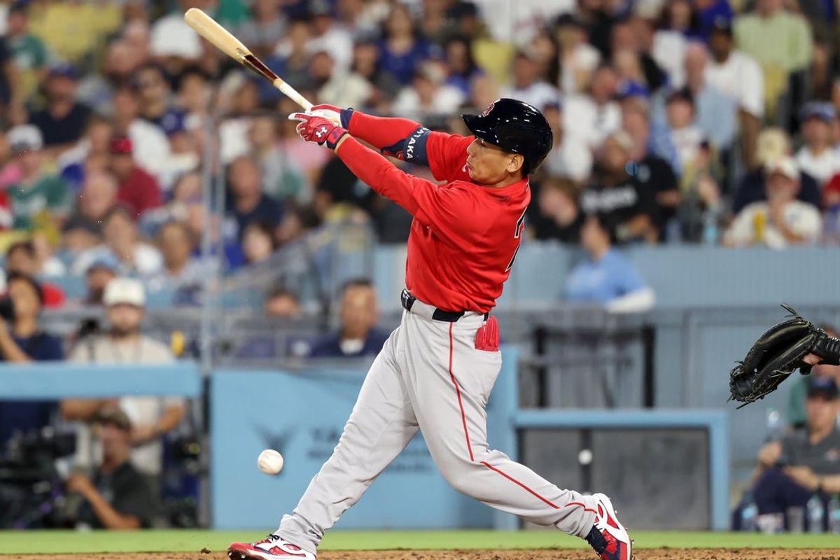 Jul 31, 2026; Los Angeles, California, USA;  Boston Red Sox designated hitter Masataka Yoshida (7) hits a single during the seventh inning against the Los Angeles Dodgers at Dodger Stadium. Mandatory Credit: Kiyoshi Mio-Imagn Images