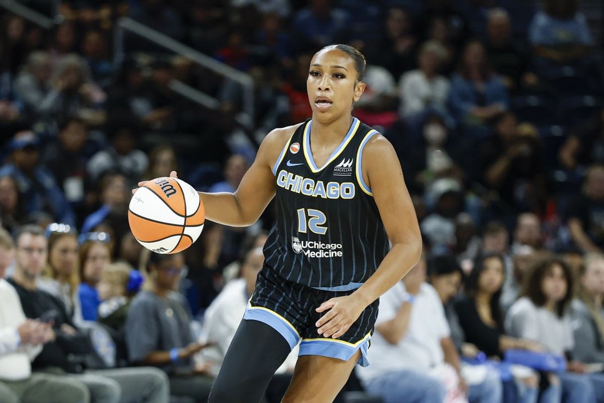 Aug 1, 2026; Chicago, Illinois, USA; Chicago Sky guard Sydney Taylor (12) drives to the basket against the Las Vegas Aces during the first half of a WNBA game at Wintrust Arena. Mandatory Credit: Kamil Krzaczynski-Imagn Images