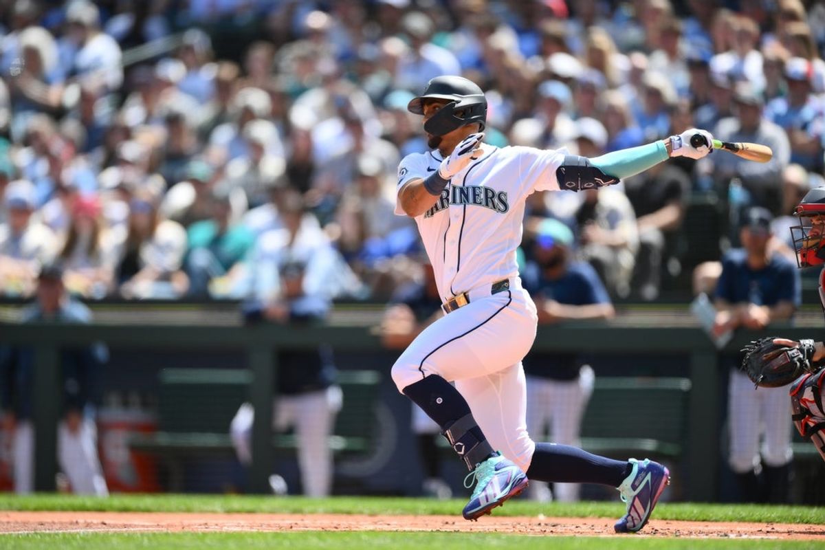 Aug 1, 2026; Seattle, Washington, USA; Seattle Mariners center fielder Julio Rodriguez (44) hits a RBI single against the Minnesota Twins during the first inning at T-Mobile Park. Mandatory Credit: Steven Bisig-Imagn Images