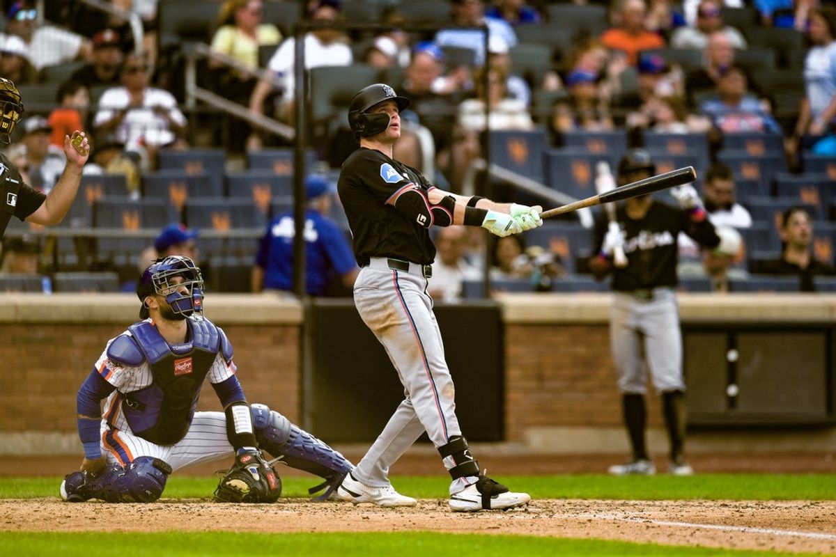 Aug 1, 2026; New York City, New York, USA; Miami Marlins right fielder Griffin Conine (18) watches the flight of his solo home run against the New York Mets during the sixth inning at Citi Field. Mandatory Credit: John Jones-Imagn Images
