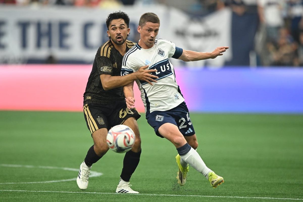 Aug 1, 2026; Vancouver, British Columbia, CAN;  Los Angeles FC midfield Mathieu Choiniere (66) battles for the ball against Vancouver Whitecaps FC midfield Ryan Gauld (25) during the first half at BC Place. Mandatory Credit: Anne-Marie Sorvin-Imagn Images