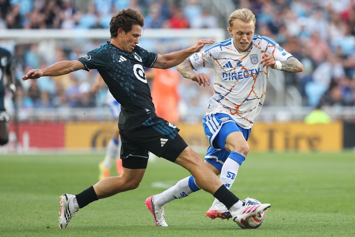 Aug 1, 2026; Saint Paul, Minnesota, USA; Minnesota United FC midfield Wil Trapp (20) makes a play on the ball as San Diego FC defense Dagur Thórhallsson (3) defends during the first half at Allianz Field. Mandatory Credit: Matt Krohn-Imagn Images