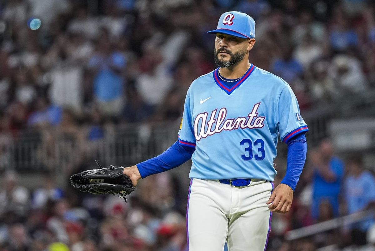 Aug 1, 2026; Cumberland, Georgia, USA; Atlanta Braves pitcher Martin Perez (33) reacts after giving up the first hit of the game by Washington Nationals third baseman Brady House (12) (not pictured) during the seventh inning at Truist Park. Mandatory Credit: Dale Zanine-Imagn Images