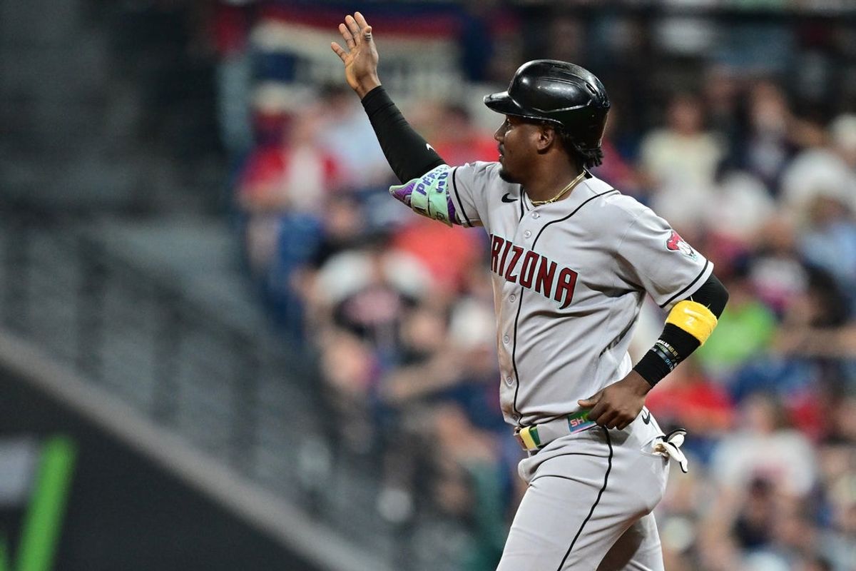 Aug 1, 2026; Cleveland, Ohio, USA; Arizona Diamondbacks shortstop Geraldo Perdomo (2) acknowledges the bullpen while running the bases after hitting a home run during the seventh inning against the Cleveland Guardians at Progressive Field. Mandatory Credit: David Dermer-Imagn Images