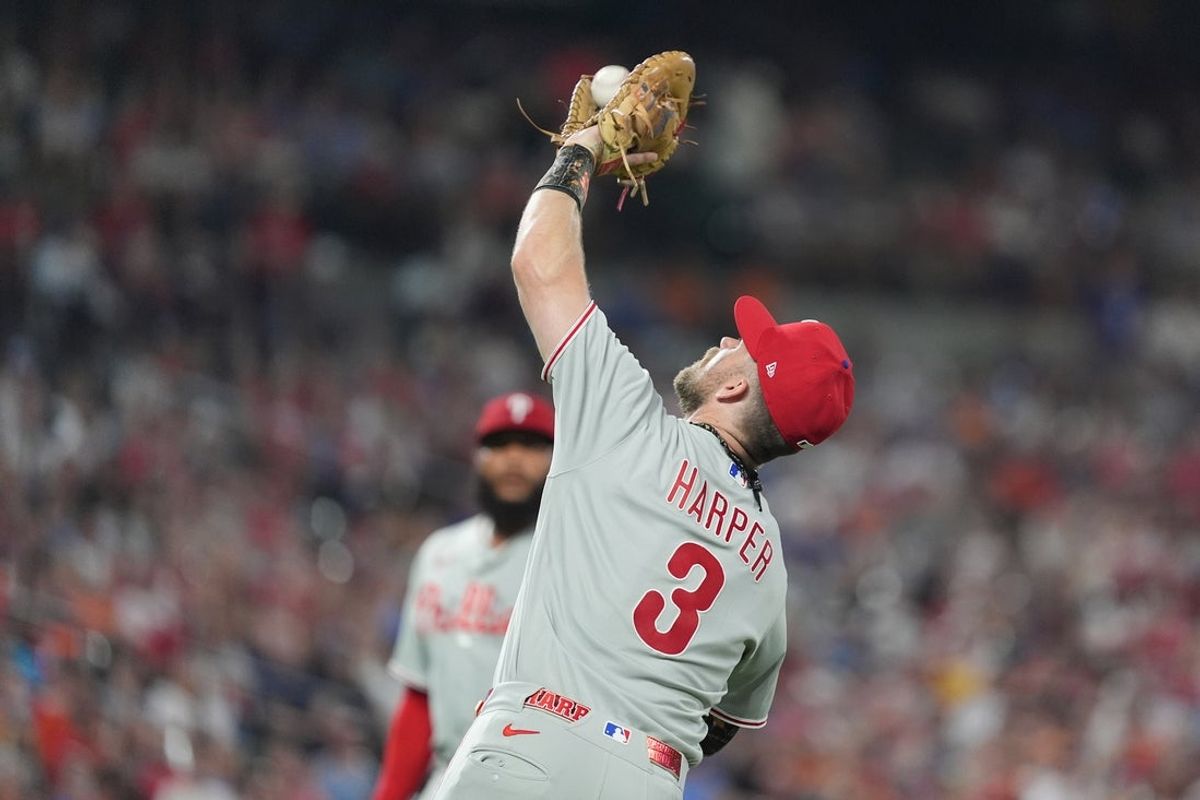 Aug 1, 2026; Baltimore, Maryland, USA; Philadelphia Phillies first baseman Bryce Harper (3) catches a fly ball hit by Baltimore Orioles right fielder Tyler O'Neill (not pictured) for an out during the eighth inning at Oriole Park at Camden Yards. Mandatory Credit: Gregory Fisher-Imagn Images