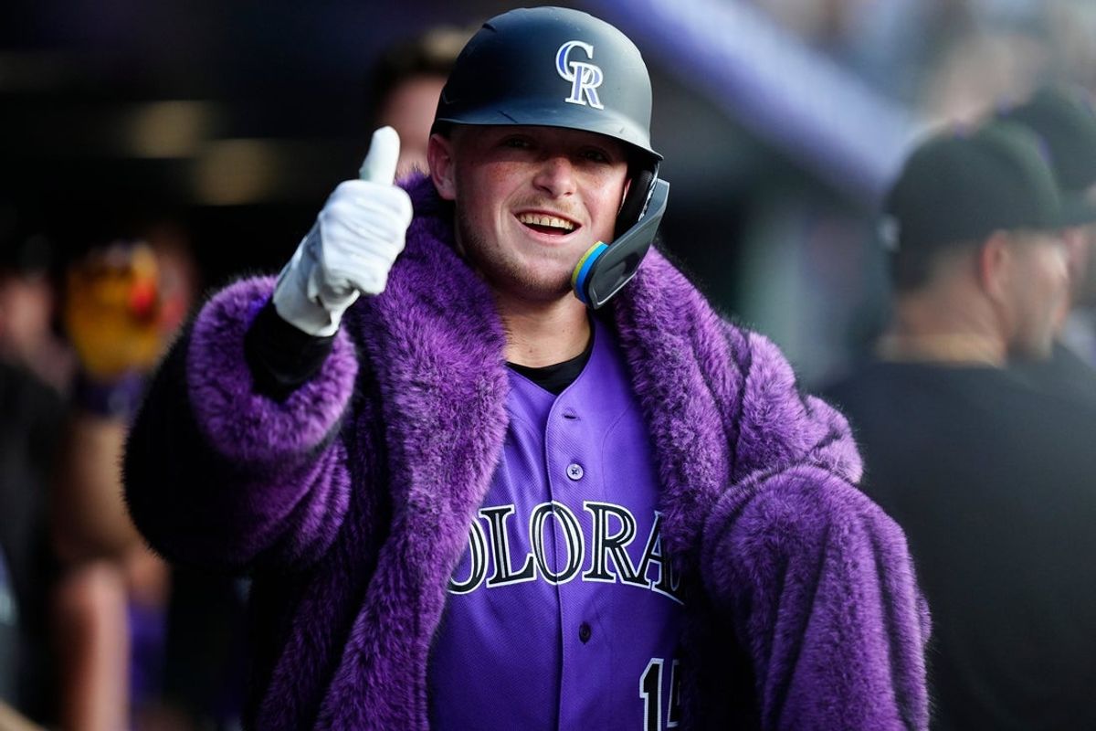 Aug 1, 2026; Denver, Colorado, USA; Colorado Rockies catcher Hunter Goodman (15) reacts in the dugout after hitting a three run home run during the third inning against the Kansas City Royals at Coors Field. Mandatory Credit: Ron Chenoy-Imagn Images