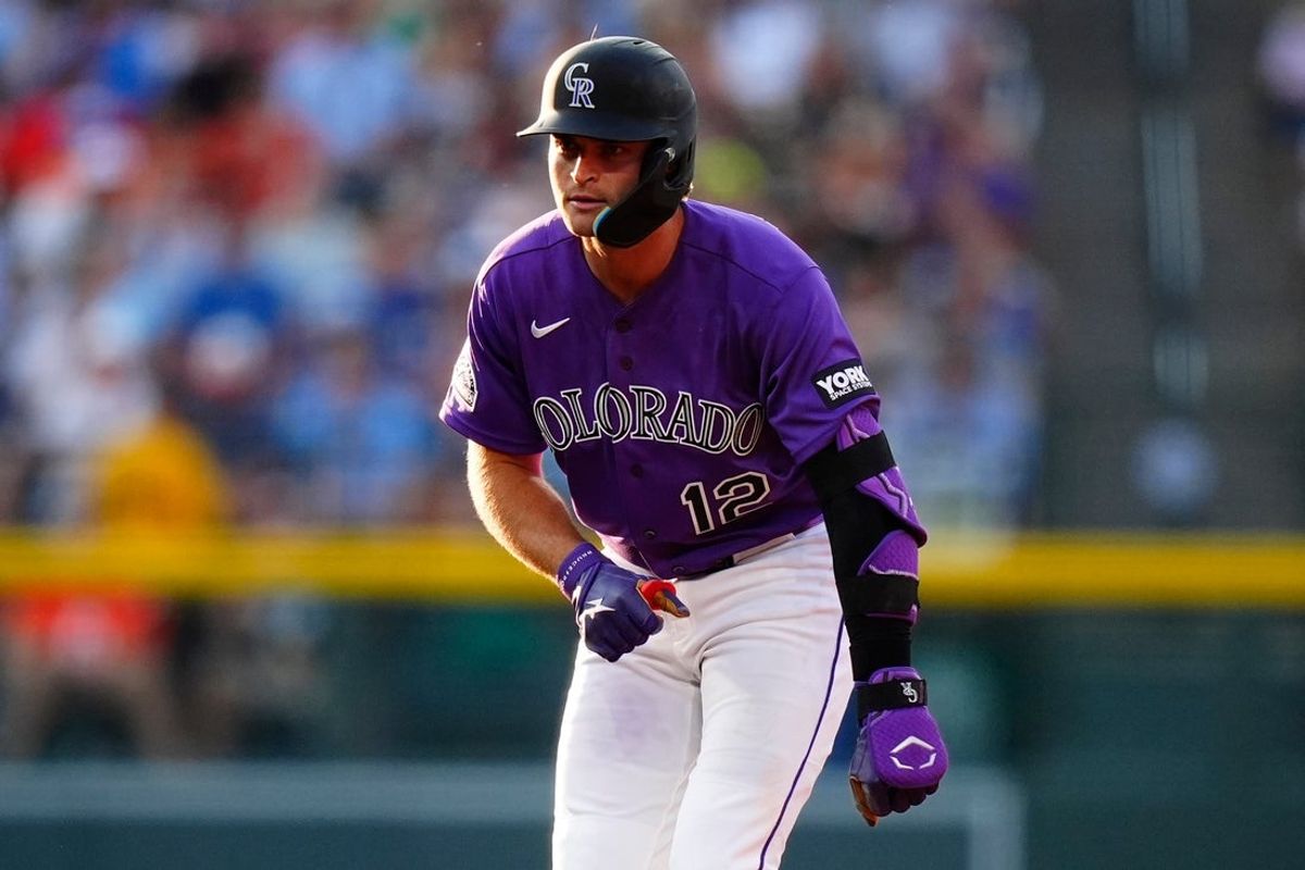 Aug 1, 2026; Denver, Colorado, USA; Colorado Rockies third baseman Kyle Karros (12) acknowledges the dugout after hitting a double in the third inning against the Kansas City Royals at Coors Field. Mandatory Credit: Ron Chenoy-Imagn Images