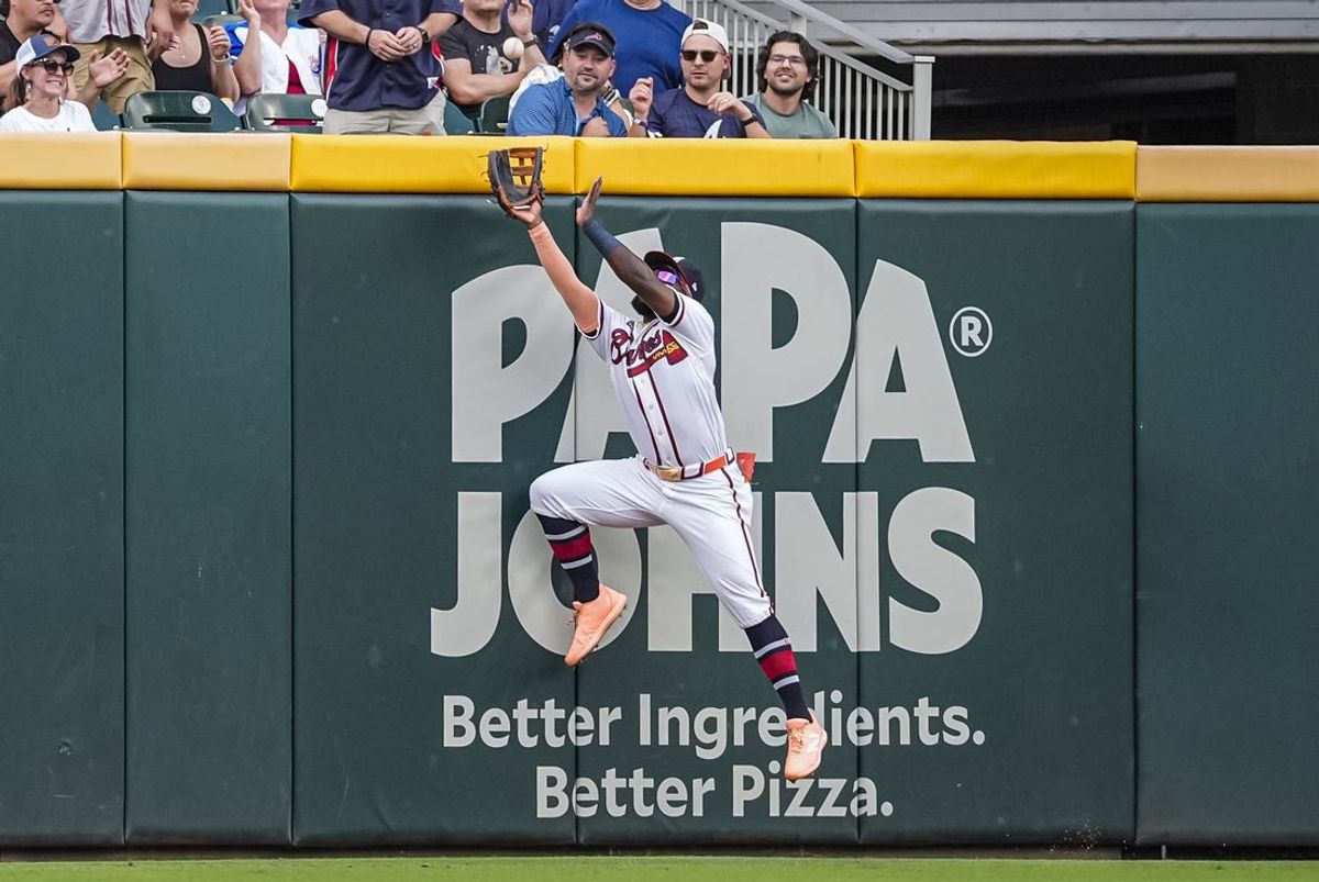 Aug 2, 2026; Cumberland, Georgia, USA; Atlanta Braves center fielder Michael Harris II (23) catches a fly ball hit by Washington Nationals right fielder Dylan Crews (3) (not shown) during the third inning at Truist Park. Mandatory Credit: Dale Zanine-Imagn Images