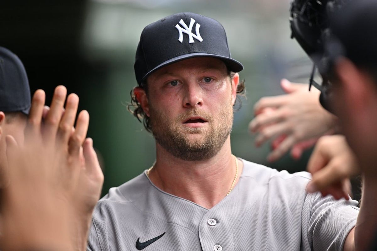 Aug 2, 2026; Chicago, Illinois, USA; New York Yankees pitcher Gerrit Cole (45) high fives teammates in the dugout after being relieved against the Chicago Cubs during the sixth inning at Wrigley Field. Mandatory Credit: Patrick Gorski-Imagn Images