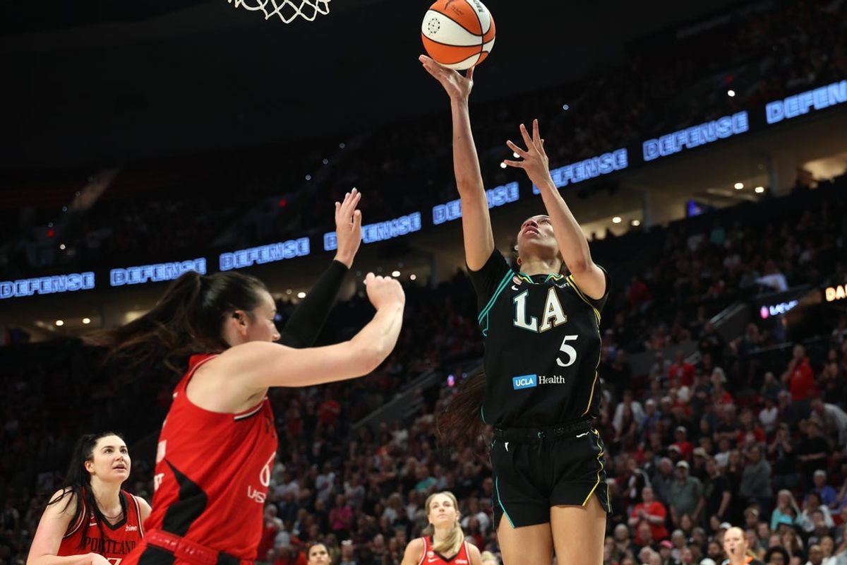 Aug 2, 2026; Portland, Oregon, USA;  Los Angeles Sparks forward Dearica Hamby (5) shoots the ball over Portland Fire forward Bridget Carleton (6) during the second half at Moda Center. Mandatory Credit: Jaime Valdez-Imagn Images