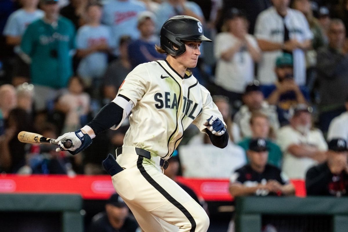 Aug 2, 2026; Seattle, Washington, USA;  Seattle Mariners shortstop Colt Emerson (4) hits a RBI-single during the ninth inning against the Minnesota Twins at T-Mobile Park. Mandatory Credit: Stephen Brashear-Imagn Images