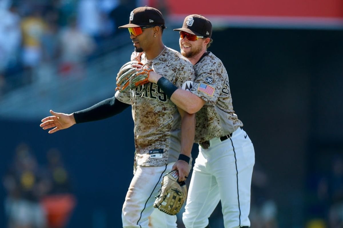 Aug 2, 2026; San Diego, California, USA; San Diego Padres second baseman Jake Cronenworth (9) celebrates with shortstop Xander Bogaerts (2) after defeating the San Francisco Giants at Petco Park. Mandatory Credit: David Frerker-Imagn Images
