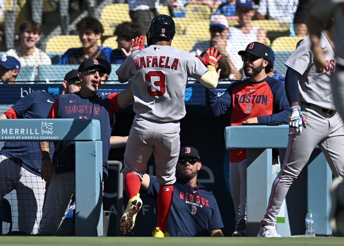 Aug 2, 2026; Los Angeles, California, USA; Boston Red Sox center fielder Ceddanne Rafaela (3) celebrates with teammates after scoring during the first inning against the Los Angeles Dodgers at Dodger Stadium. Mandatory Credit: Jonathan Hui-Imagn Images