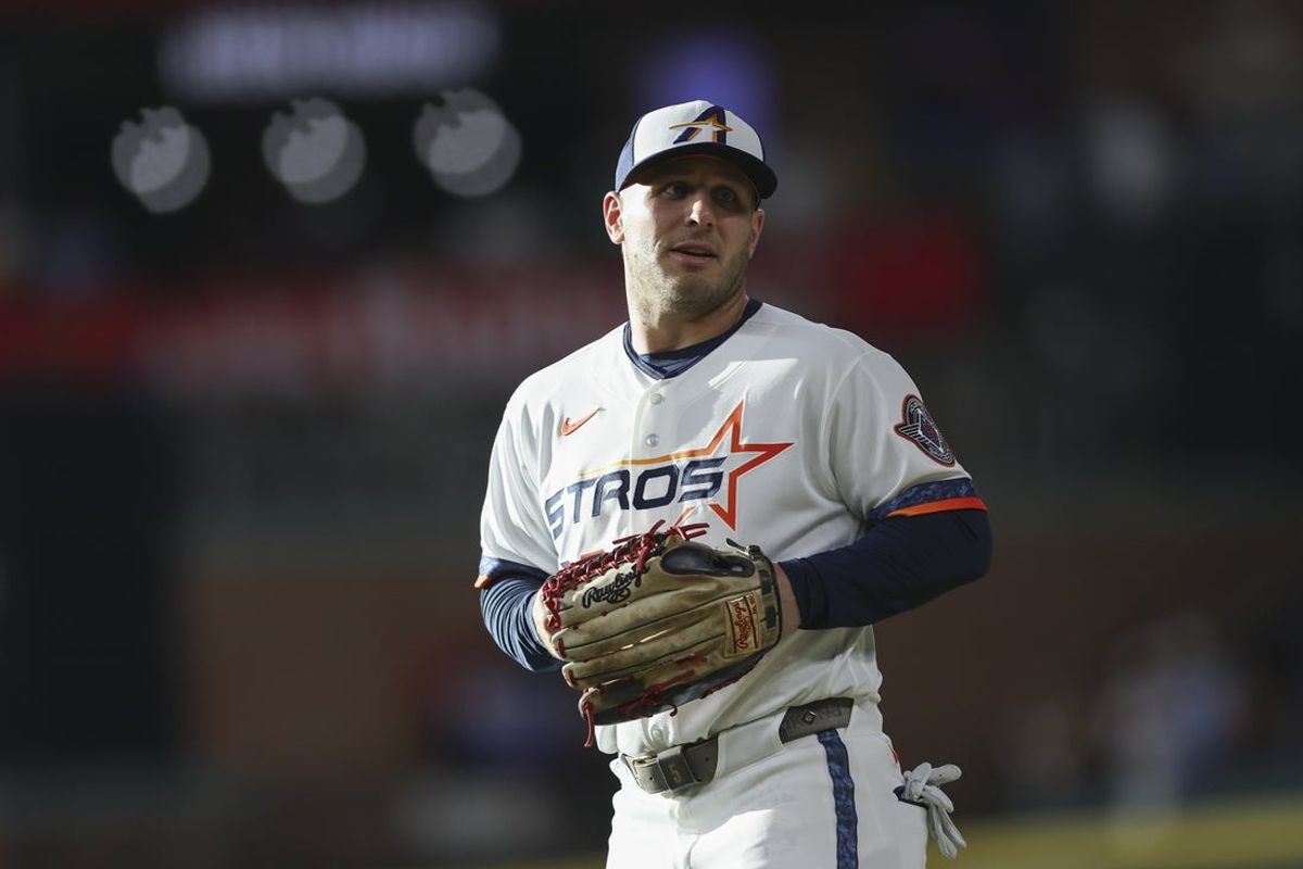 Aug 3, 2026; Houston, Texas, USA; Houston Astros center fielder Daulton Varsho (18) warms up before the game against the Toronto Blue Jays at Daikin Park. Mandatory Credit: Troy Taormina-Imagn Images