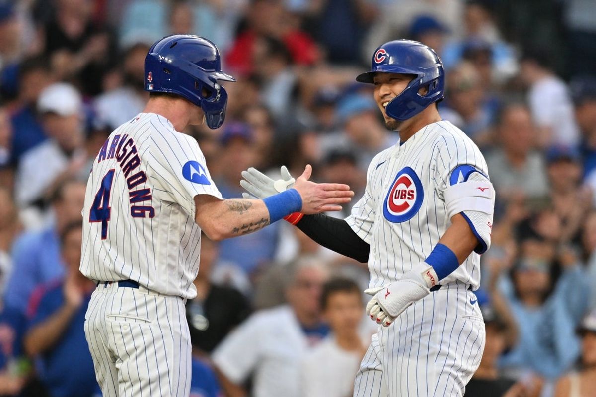 Aug 3, 2026; Chicago, Illinois, USA; Chicago Cubs right fielder Seiya Suzuki (27) celebrates his two-run home run with center fielder Pete Crow-Armstrong (4) against the Los Angeles Dodgers during the first inning at Wrigley Field. Mandatory Credit: Patrick Gorski-Imagn Images