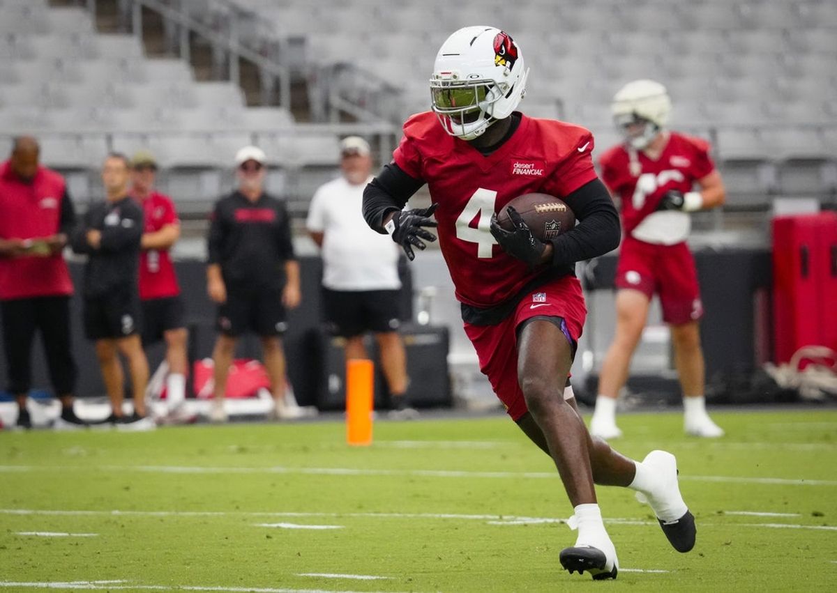 Cardinals running back Jeremiyah Love (4) sprints down the field during training camp at State Farm Stadium in Glendale on July 23, 2026.