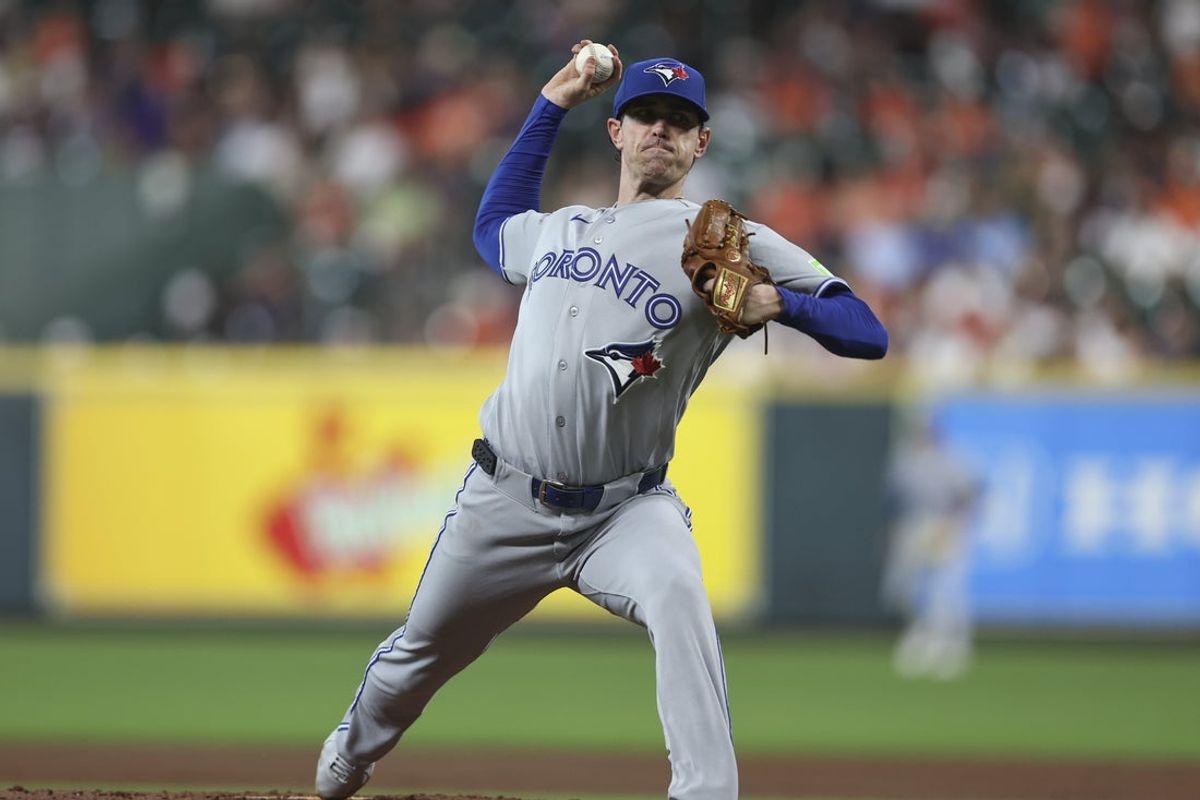 Aug 3, 2026; Houston, Texas, USA; Toronto Blue Jays starting pitcher Shane Bieber (57) delivers a pitch during the second inning against the Houston Astros at Daikin Park. Mandatory Credit: Troy Taormina-Imagn Images