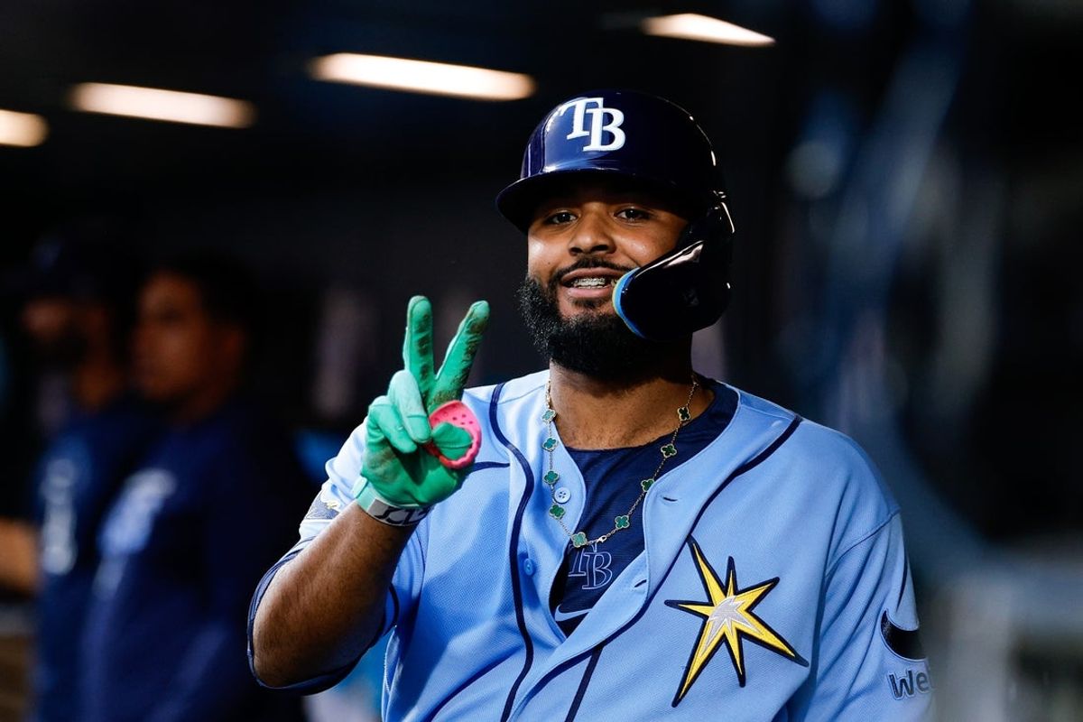 Aug 3, 2026; Denver, Colorado, USA; Tampa Bay Rays third baseman Junior Caminero (13) gestures in the dugout after a solo home run in the fourth inning and his second of the game against the Colorado Rockies at Coors Field. Mandatory Credit: Isaiah J. Downing-Imagn Images